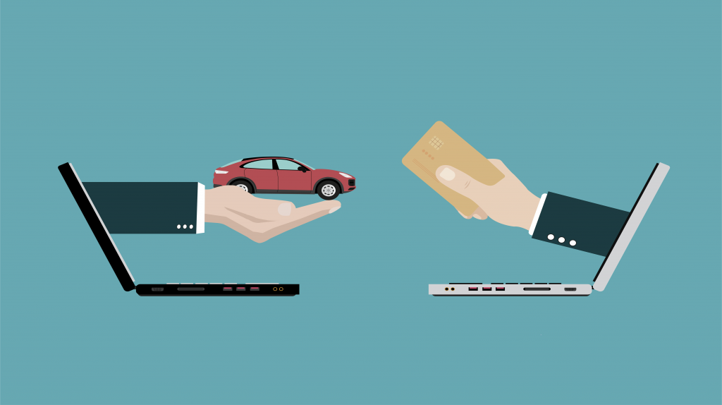 Online car buying transaction with laptop, vehicle, and credit card payment.